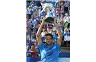 EASTBOURNE, ENGLAND - JUNE 21:  Feliciano Lopez of Spain celebrates with the trophy after beating Richard Gasquet of France during their Men's Singles Finals match on day eight of the Aegon International at Devonshire Park on June 21, 2014 in Eastbourne, England. (Photo by Jan Kruger/Getty Images)